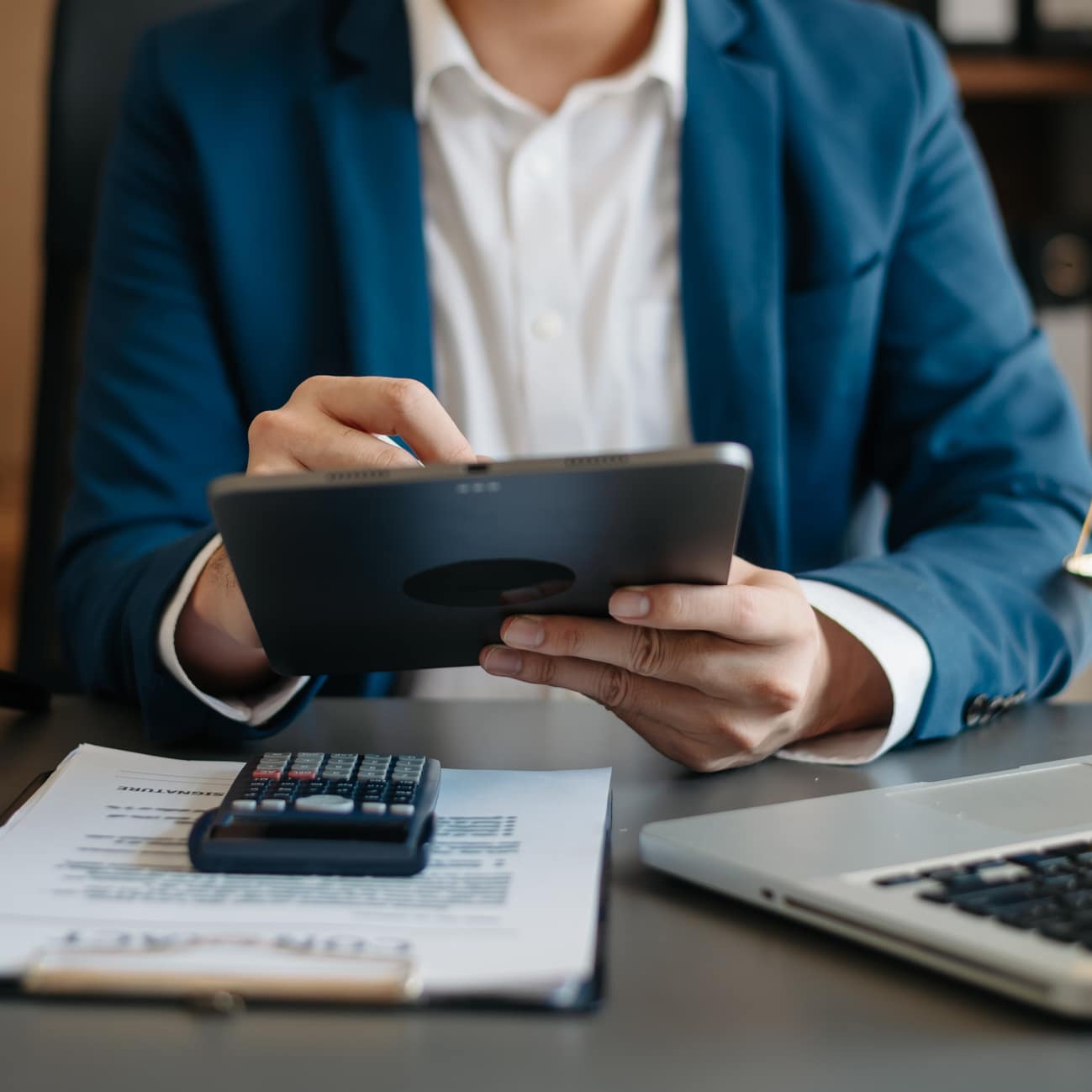 attorney with ipad and calculator